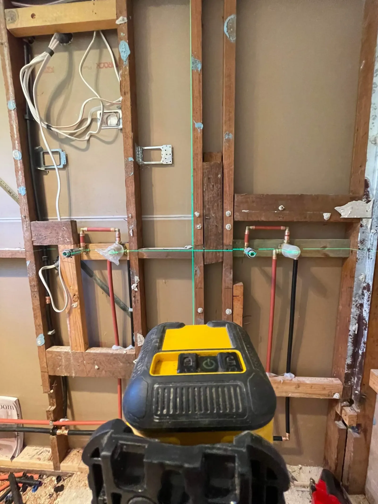 Wall lining removed and a wet vacuum used to dry out a leak