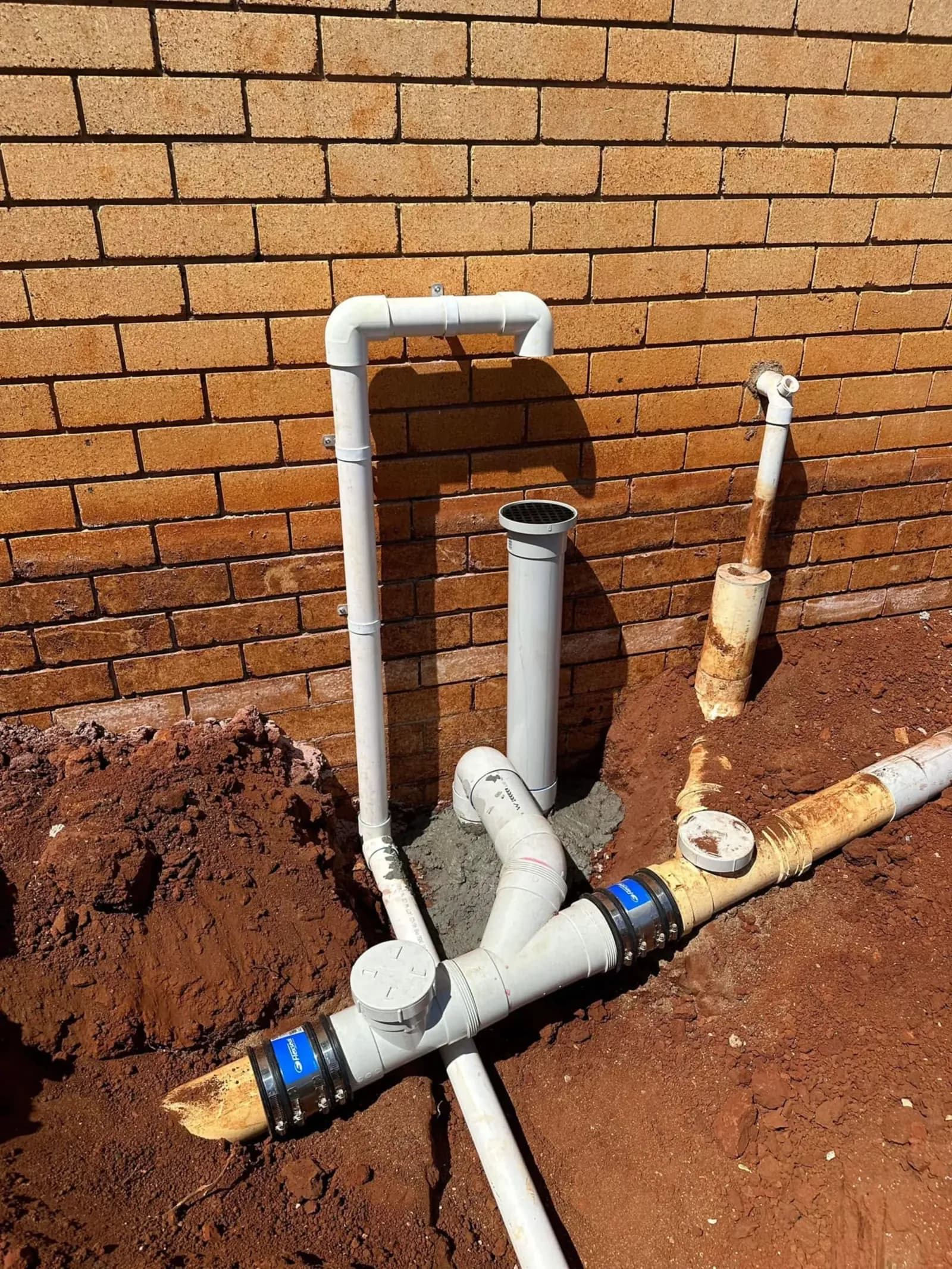 New PVC drain junction laid in an open trench