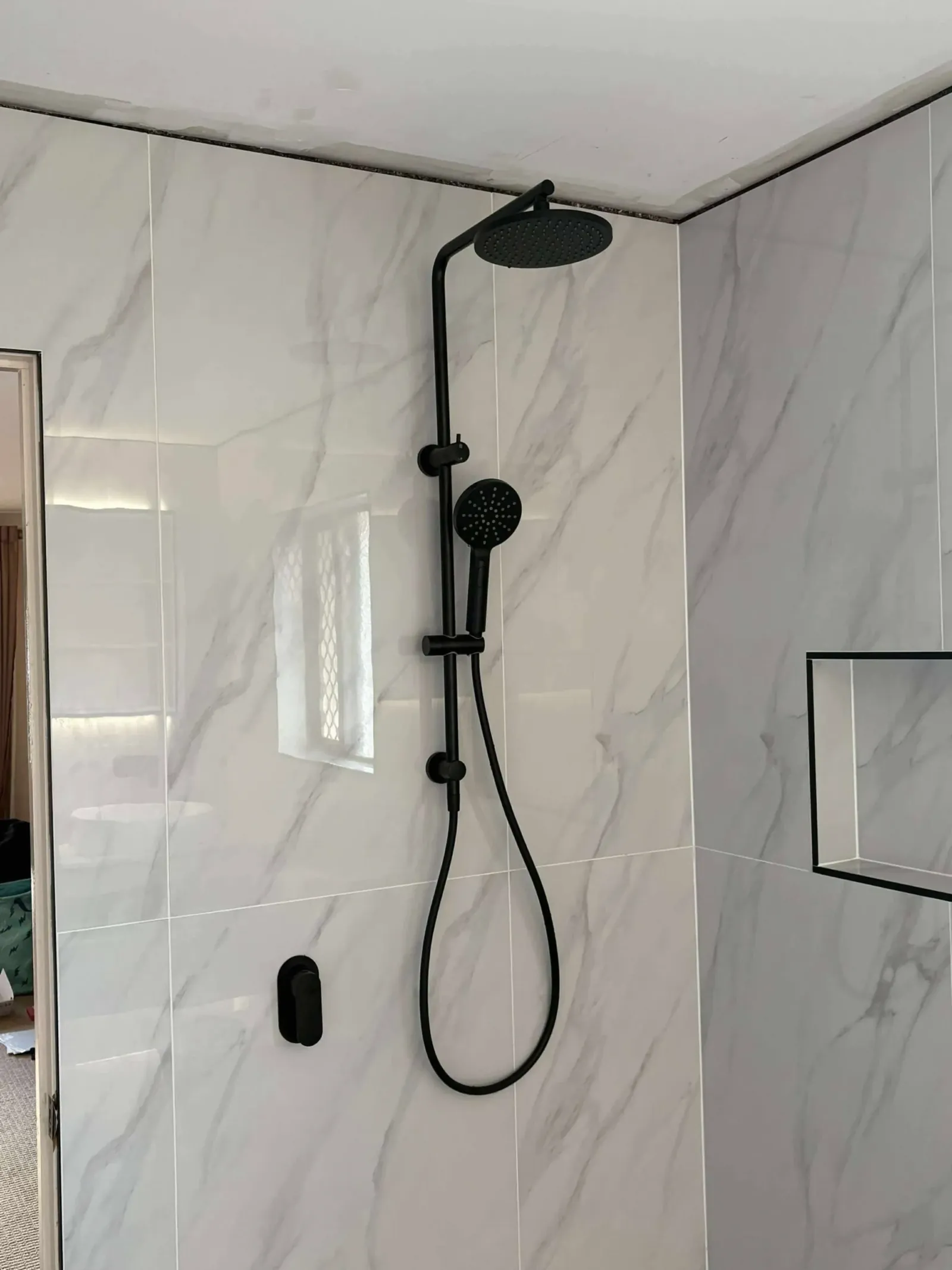 Newly installed shower fittings in a renovated bathroom