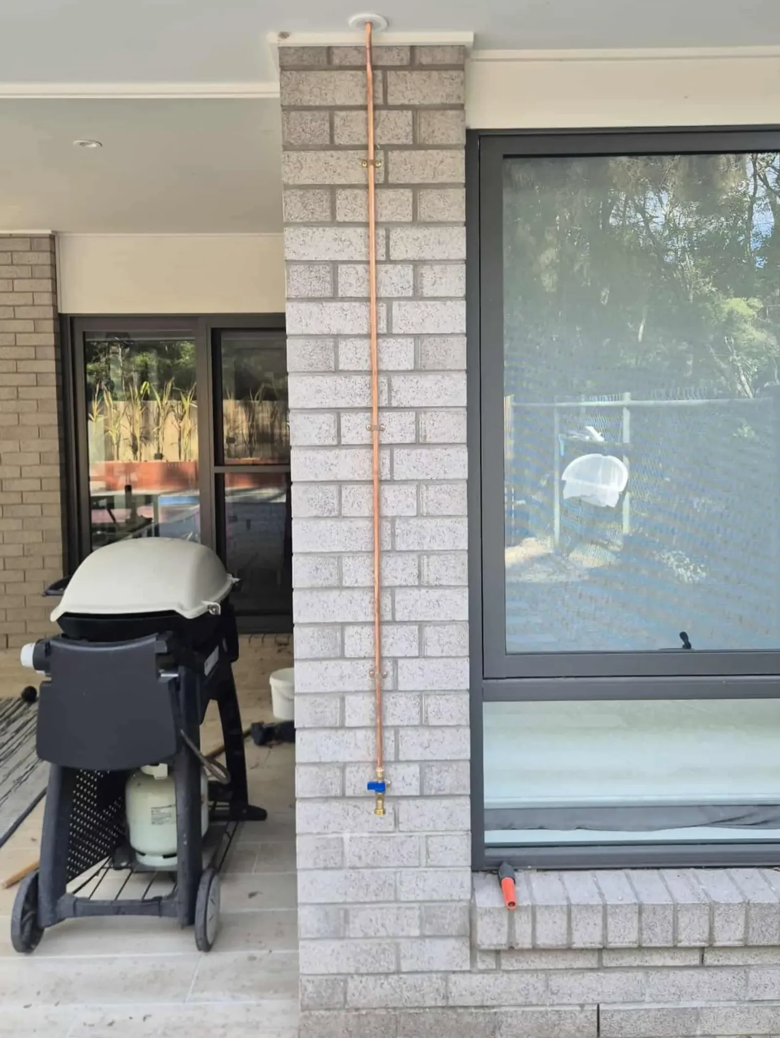 Barbecue connected to a new gas line on a patio