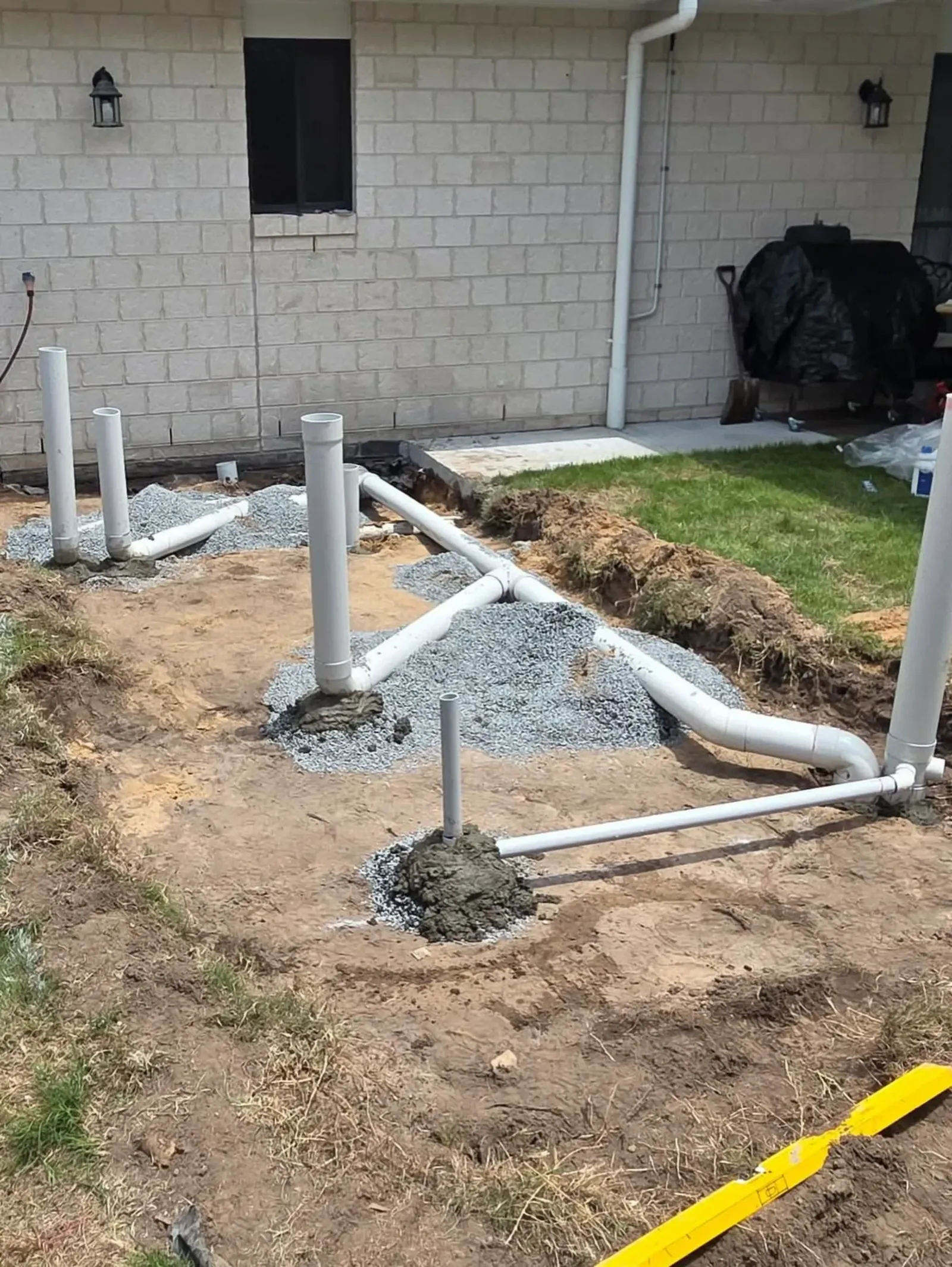 New sewer and stormwater pipes laid behind a house