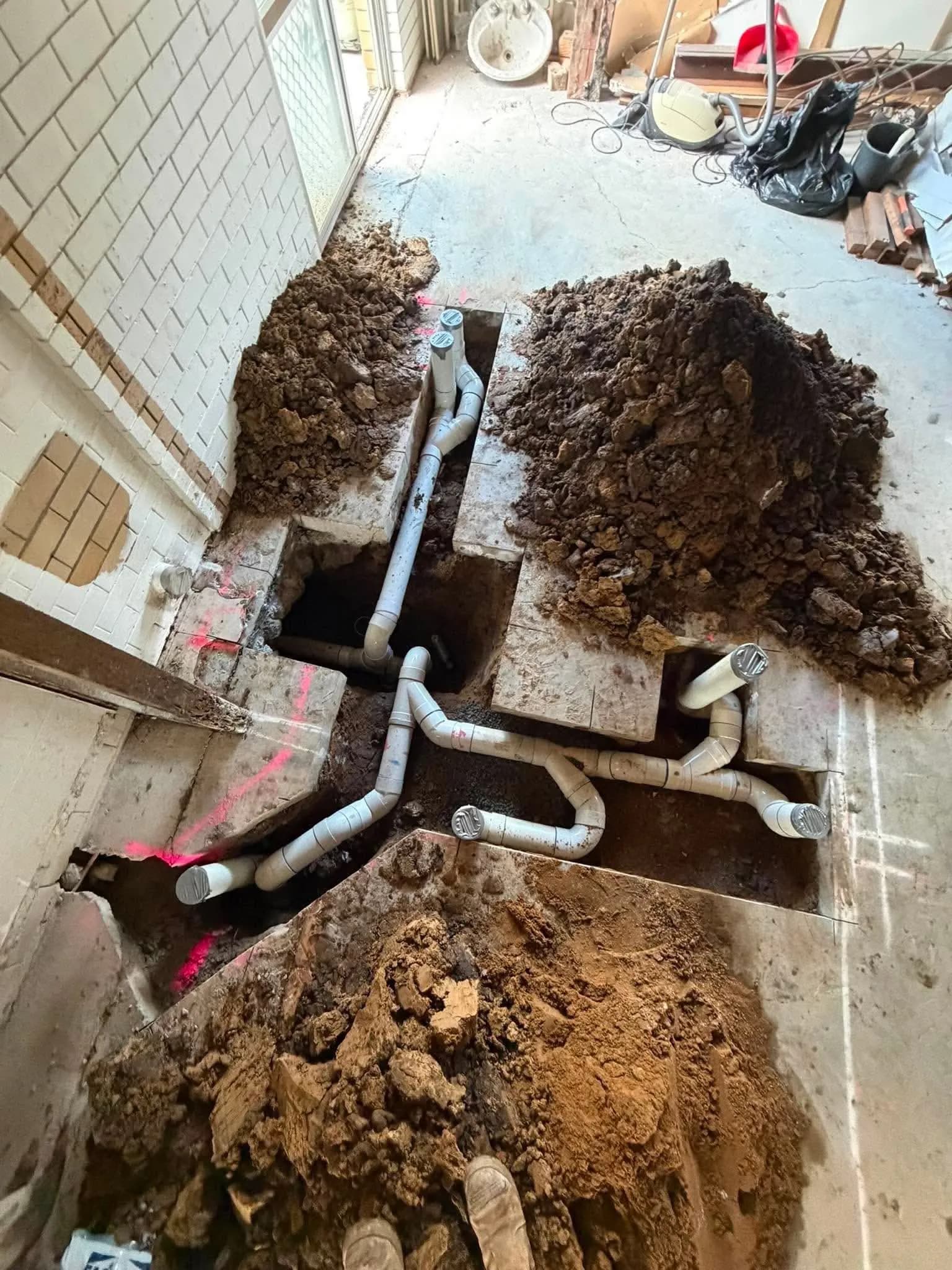 Floor slab opened up to repair the drain pipes beneath