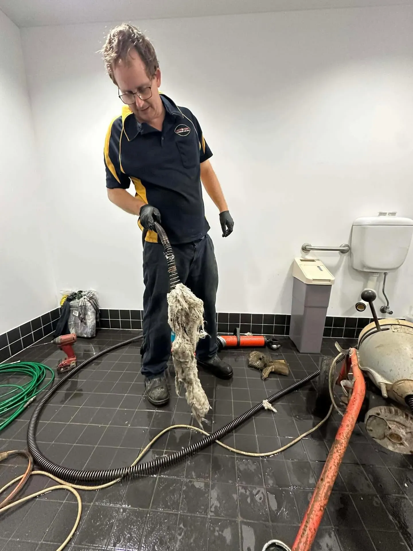 Plumber clearing a blocked drain with a jet rodder in Thorneside